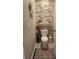 Powder room featuring brick accent wall and modern toilet at 16725 Delia St, Wimauma, FL 33598