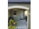 Cozy front porch featuring a seating area and potted plants at 16725 Delia St, Wimauma, FL 33598