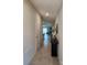 Bright hallway leading to an open-concept living space at 16725 Delia St, Wimauma, FL 33598