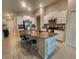 Spacious kitchen with a large island, modern appliances, and ample cabinet space at 16725 Delia St, Wimauma, FL 33598