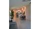 Bright, open-concept living room featuring tile flooring, a modern kitchen, and a dining area at 16725 Delia St, Wimauma, FL 33598