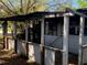 Damaged backyard shed with missing walls and visible structural damage at 1716 Lancelot Loop, Tampa, FL 33619