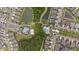 Aerial view featuring community amenities including pools, green spaces, ponds, and walking paths at 1767 Tonka Ter, Wesley Chapel, FL 33543