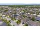 Wide aerial view of the community showcasing the layout of homes and streetscapes at 1767 Tonka Ter, Wesley Chapel, FL 33543