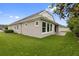 Expansive backyard with lush green lawn and patio at 1767 Tonka Ter, Wesley Chapel, FL 33543