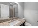 Bright bathroom with granite countertop vanity, framed mirror, and tile flooring at 1767 Tonka Ter, Wesley Chapel, FL 33543