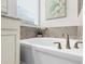 Close-up of a bathtub in the bathroom, inviting relaxation and a spa-like experience at home at 1767 Tonka Ter, Wesley Chapel, FL 33543