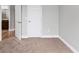 Spare bedroom featuring a view into the hallway and lots of natural light at 1767 Tonka Ter, Wesley Chapel, FL 33543