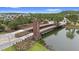 Community entrance over the water via unique wooden bridge with a tower at 1767 Tonka Ter, Wesley Chapel, FL 33543