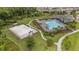 Aerial view of the community's recreational area with pool, basketball court, and walking path at 1767 Tonka Ter, Wesley Chapel, FL 33543