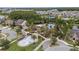 Aerial view of the community center with pool, splash pad, and green spaces at 1767 Tonka Ter, Wesley Chapel, FL 33543