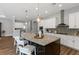 Beautiful kitchen with a large center island, stainless steel appliances, granite countertops, and pendant lighting at 1767 Tonka Ter, Wesley Chapel, FL 33543
