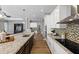 Modern kitchen showcasing a large island, stainless steel appliances, and sleek countertops at 1767 Tonka Ter, Wesley Chapel, FL 33543