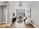 Living room features hardwood floors, columns, and a neutral color scheme with modern decor at 1767 Tonka Ter, Wesley Chapel, FL 33543