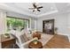 Bright living room features ceiling fan and glass sliding doors that offer seamless indoor-outdoor living at 1767 Tonka Ter, Wesley Chapel, FL 33543