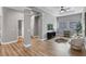 Living room featuring hardwood floors, columns, and a neutral color scheme with two windows at 1767 Tonka Ter, Wesley Chapel, FL 33543