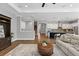 Spacious living room that flows to the kitchen area, offering a layout perfect for entertaining Gathering and guests at 1767 Tonka Ter, Wesley Chapel, FL 33543