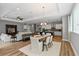 Open-concept living space with a dining area, kitchen, and cozy seating, perfect for modern living at 1767 Tonka Ter, Wesley Chapel, FL 33543
