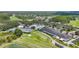 Aerial view of the community clubhouse with pool, tennis courts, and golf course at 18148 Nassau Point Dr, Tampa, FL 33647