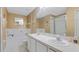 Bathroom featuring dual sinks, and a shower-tub combination, and tile flooring at 18148 Nassau Point Dr, Tampa, FL 33647