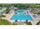 Community pool featuring lap lanes, a lazy river, poolside seating and tennis courts at 18148 Nassau Point Dr, Tampa, FL 33647