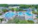 Aerial view of the community pool featuring lap lanes, a lazy river and tennis courts at 18148 Nassau Point Dr, Tampa, FL 33647