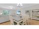 Bright dining area with wood-look floors open to living area at 18148 Nassau Point Dr, Tampa, FL 33647