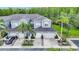 Charming townhome with attached garages, lush landscaping, and a serene wooded backdrop at 18148 Nassau Point Dr, Tampa, FL 33647