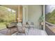Screened patio featuring comfortable wicker seating, providing a relaxing outdoor space at 18148 Nassau Point Dr, Tampa, FL 33647