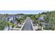 Street view of a community with sidewalks and townhomes lining the streets and palm trees at 18148 Nassau Point Dr, Tampa, FL 33647