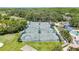 Aerial view of community tennis courts, showcasing well-maintained facilities and lush surroundings at 18148 Nassau Point Dr, Tampa, FL 33647