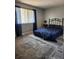 Comfortable bedroom with a wrought iron bed frame, plush bedding, and a patterned rug at 1833 Bough Ave # 2, Clearwater, FL 33760
