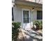 Charming front door with welcome mat and decorative signage near well-maintained landscaping at 1833 Bough Ave # 2, Clearwater, FL 33760