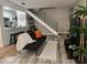Cozy living room featuring stairs, modern furniture, and stylish decor at 1833 Bough Ave # 2, Clearwater, FL 33760