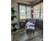 Cozy sitting area with comfortable chair, natural light, and stylish decor at 1833 Bough Ave # 2, Clearwater, FL 33760