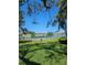 Community tennis courts for residents, set against a backdrop of green lawns and manicured landscaping at 1833 Bough Ave # 2, Clearwater, FL 33760