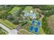 Community amenities with tennis courts, swimming pool, playground, and verdant landscaping, perfect for recreation at 18967 Wood Sage Dr, Tampa, FL 33647