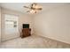 Bedroom showcasing neutral carpet and a ceiling fan and natural light at 18967 Wood Sage Dr, Tampa, FL 33647