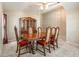 Traditional dining room featuring a wooden table with seating for six and a classic china cabinet at 18967 Wood Sage Dr, Tampa, FL 33647