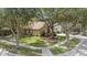 Well-maintained single-Gathering home with lush landscaping, mature trees, and a welcoming front entrance at 18967 Wood Sage Dr, Tampa, FL 33647