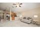Bright and airy living room with neutral tones, open layout, and seamless kitchen access at 18967 Wood Sage Dr, Tampa, FL 33647