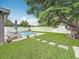 Beautiful backyard with a pool and a large tree at 1921 Ridgewood Dr, Clearwater, FL 33763
