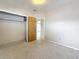 Bright bedroom with a closet and view to another room at 1921 Ridgewood Dr, Clearwater, FL 33763