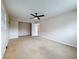 Spacious bedroom with ceiling fan and large window at 1921 Ridgewood Dr, Clearwater, FL 33763