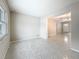Large living room with terrazzo floors, neutral walls, and an open feel at 1921 Ridgewood Dr, Clearwater, FL 33763