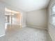 Bright living room with terrazzo floors flowing into the dining area, creating an inviting, open space at 1921 Ridgewood Dr, Clearwater, FL 33763