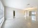 Bright and open living room with sleek terrazzo flooring and ample natural light at 1921 Ridgewood Dr, Clearwater, FL 33763