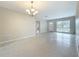 Open-concept living space with terrazzo floors, bright lighting, and spacious feel at 1921 Ridgewood Dr, Clearwater, FL 33763