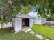 Outdoor shed in a grassy backyard at 1921 Ridgewood Dr, Clearwater, FL 33763