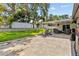 Inviting backyard with a well-manicured lawn and a covered patio, ideal for outdoor relaxation at 1960 Sever Dr, Clearwater, FL 33764
